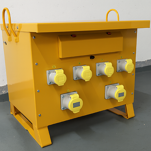 Yellow industrial power distribution box with six covered electrical outlets on gray floor.